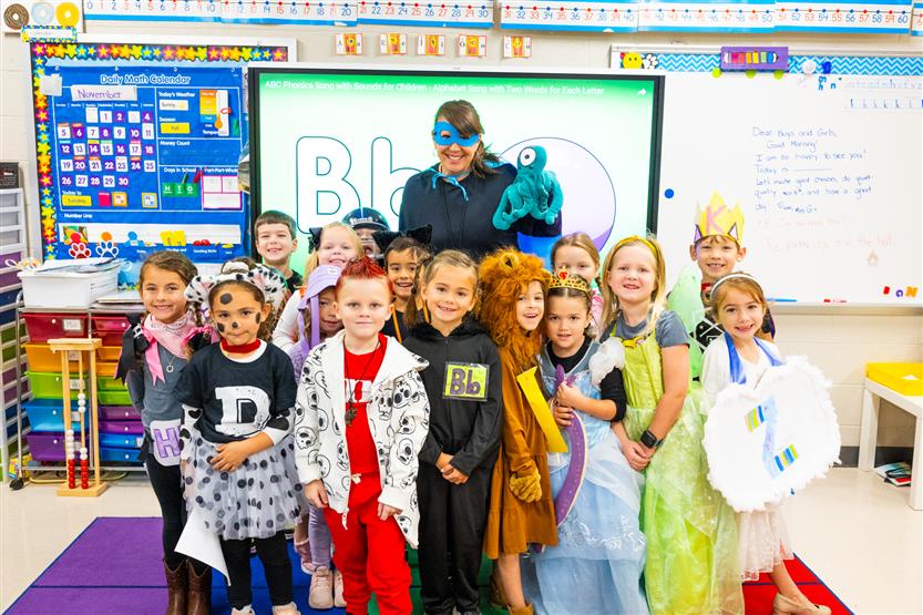 Students participate in an alphabet parade